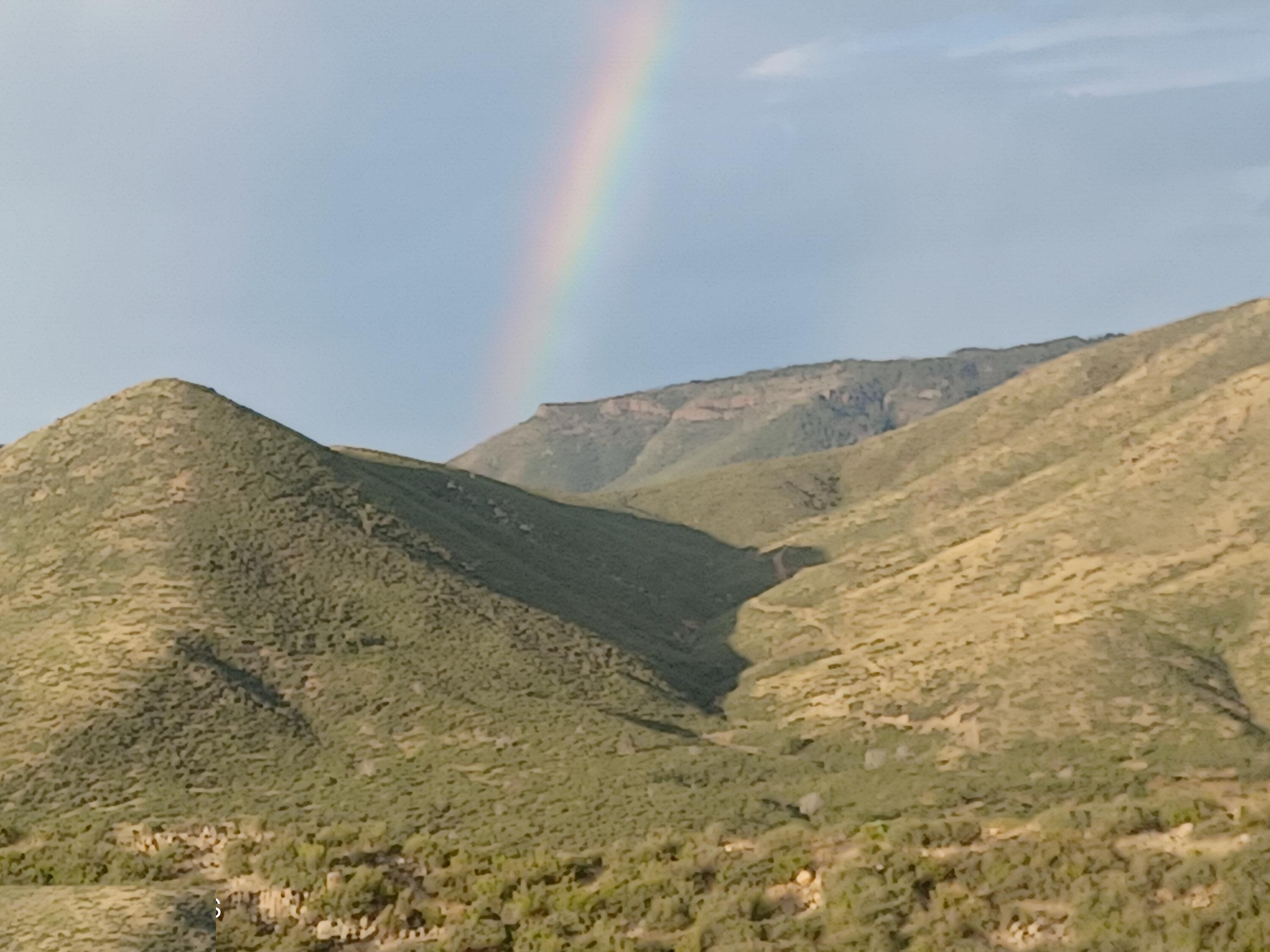 Monsoon rainbow over the Bradshaw ridges at evening