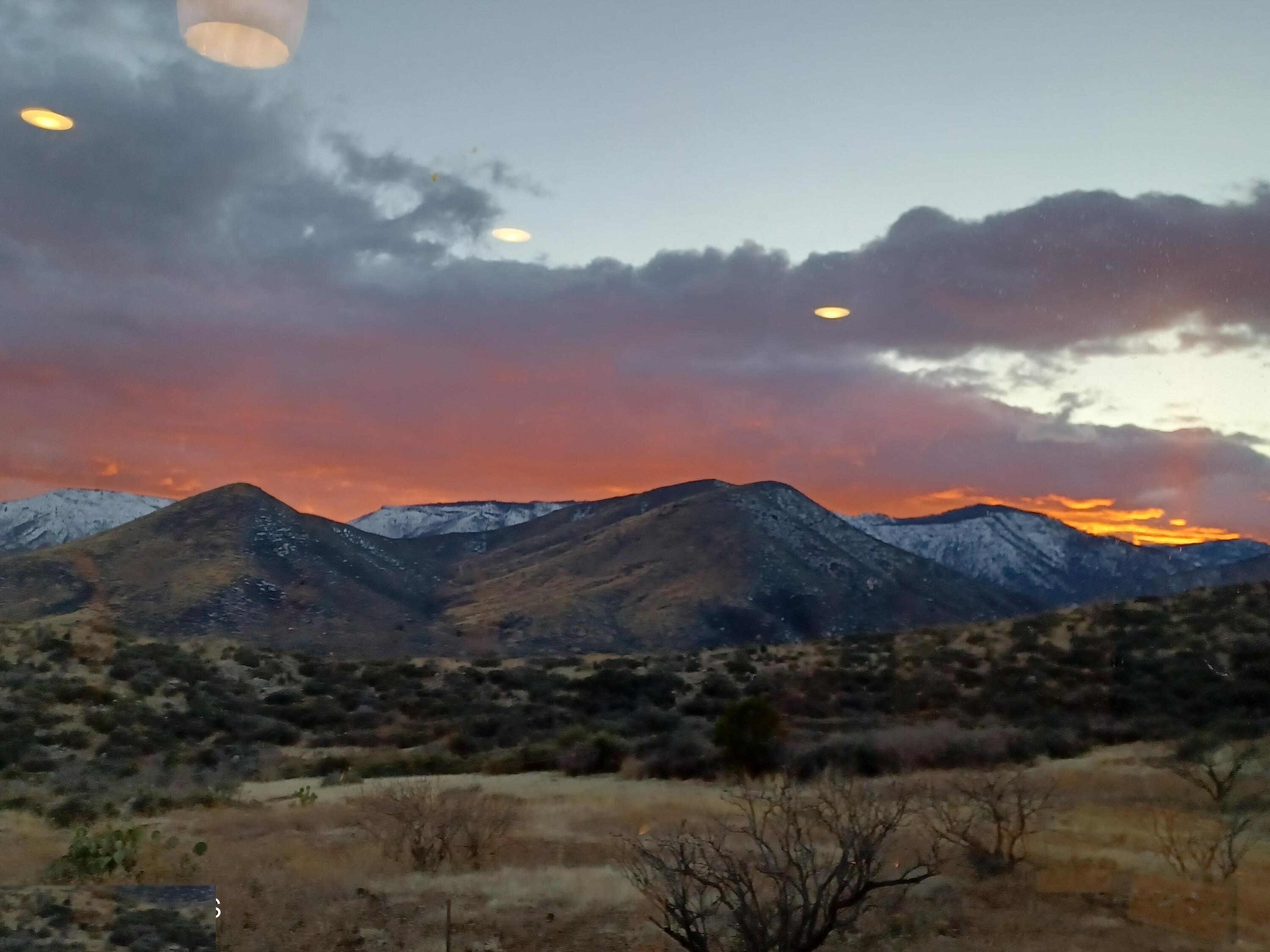 Winter sunset with snow-capped peaks